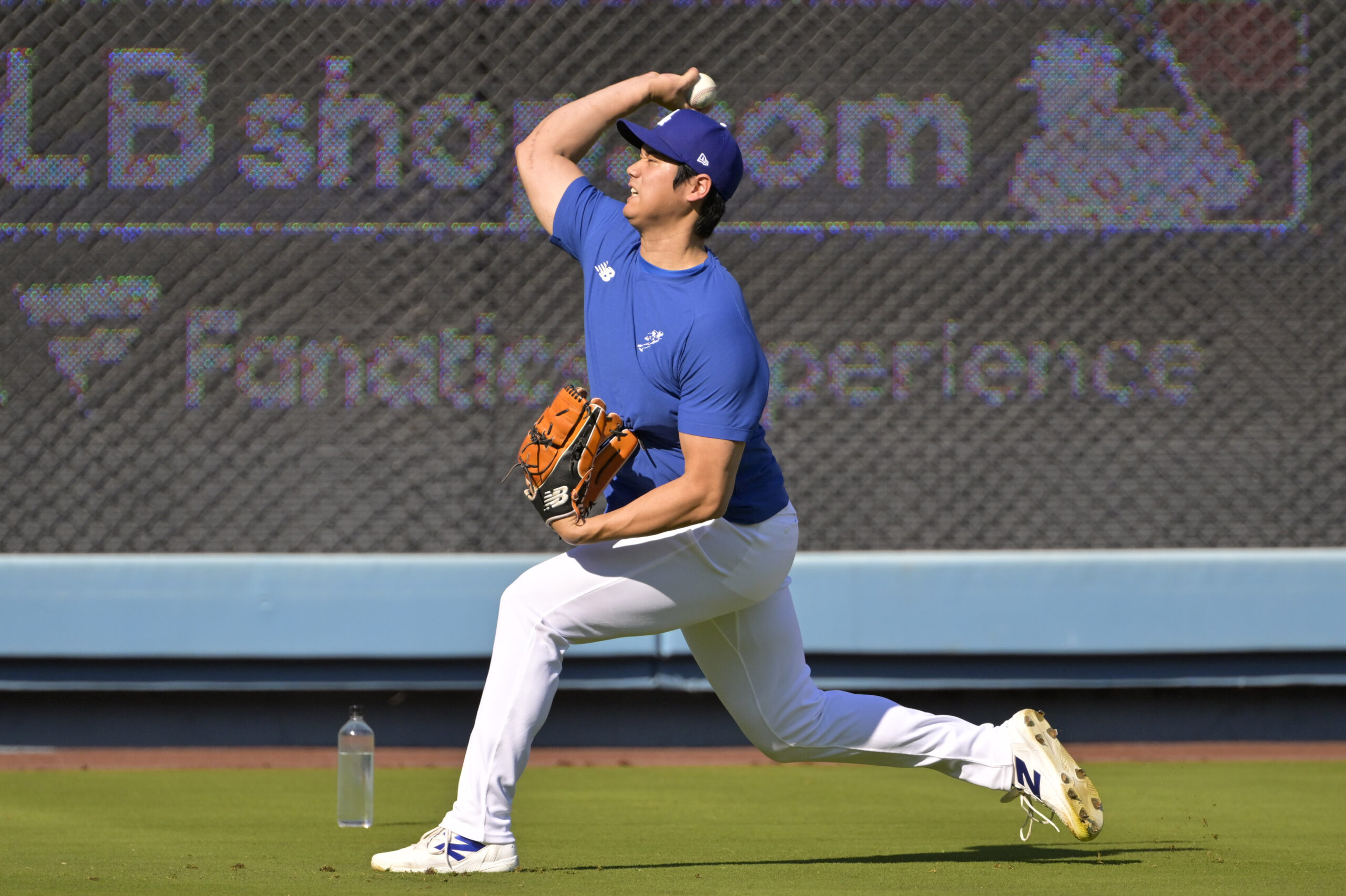 Oct 20, 2024; Los Angeles, California, USA; Los Angeles Dodgers designated hitter Shohei Ohtani (17) warms up before game six against the New York Mets in the NLCS for the 2024 MLB playoffs at Dodger Stadium. Mandatory Credit: Jayne Kamin-Oncea-Imagn Images