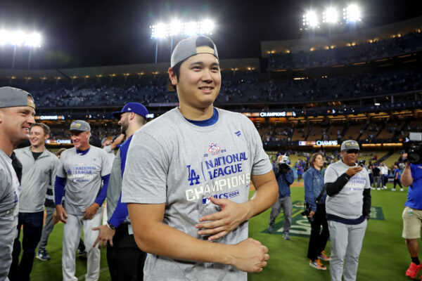 Oct 20, 2024; Los Angeles, California, USA; Los Angeles Dodgers two-way player Shohei Ohtani (17) celebrates after beating the New York Mets during game six of the NLCS for the 2024 MLB playoffs at Dodger Stadium. Mandatory Credit: Kiyoshi Mio-Imagn Images