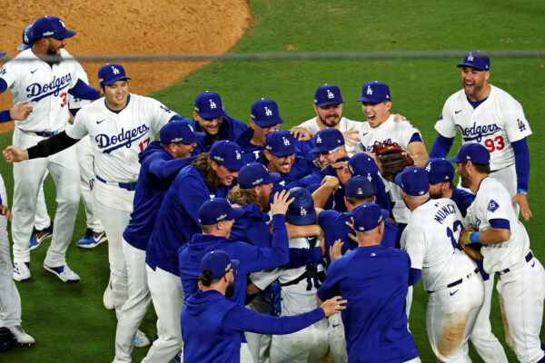 Oct 20, 2024; Los Angeles, California, USA; The Los Angeles Dodgers celebrate after beating the New York Mets in game six of the NLCS for the 2024 MLB playoffs at Dodger Stadium. Mandatory Credit: Kiyoshi Mio-Imagn Images