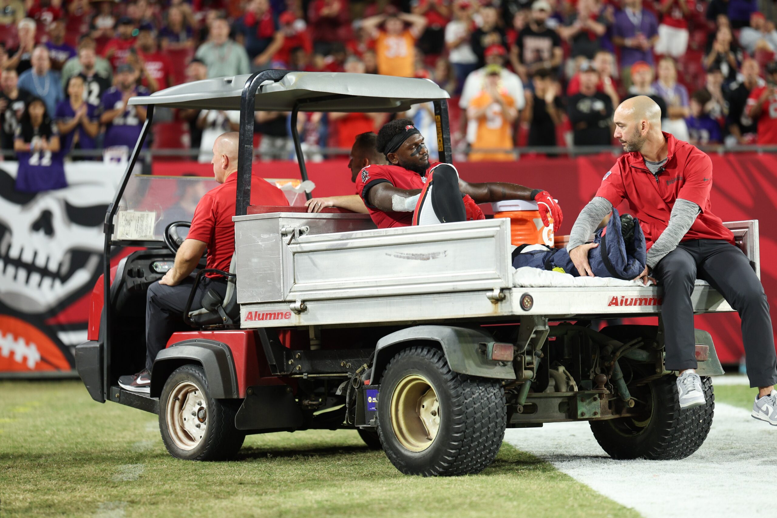 Oct 21, 2024; Tampa, Florida, USA; Tampa Bay Buccaneers wide receiver Chris Godwin (14) is carted off the field against the Baltimore Ravens in the fourth quarter at Raymond James Stadium. Mandatory Credit: Nathan Ray Seebeck-Imagn Images