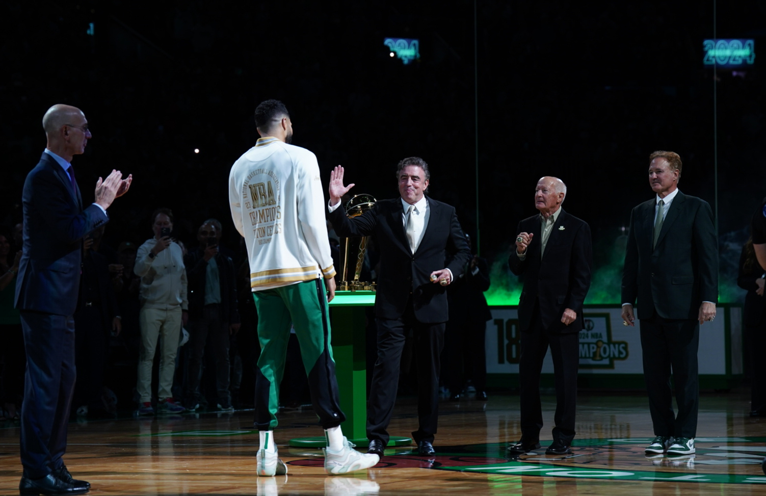 Oct 22, 2024; Boston, Massachusetts, USA; Boston Celtics forward Jayson Tatum (0) is presented with a championship ring during the opening night banner raising ceremony before the start of the game against the New York Knicks at TD Garden.