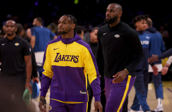 Oct 22, 2024; Los Angeles, California, USA; Los Angeles Lakers guard Bronny James (9) and forward LeBron James (23) warm up before a game against the Minnesota Timberwolves at Crypto.com Arena.