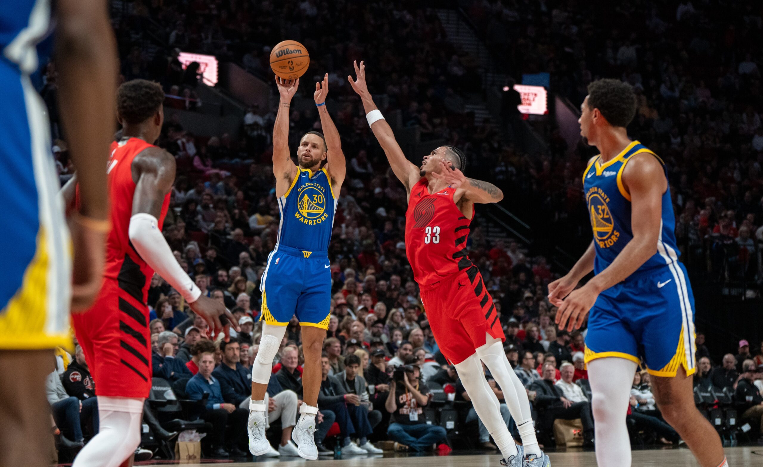 Oct 23, 2024; Portland, Oregon, USA; Golden State Warriors point guard Stephen Curry (30) shoots the ball against Portland Trailblazers forward Toumani Camara (33) during the second half at Moda Center. Mandatory Credit: Stephen Brashear-Imagn Images