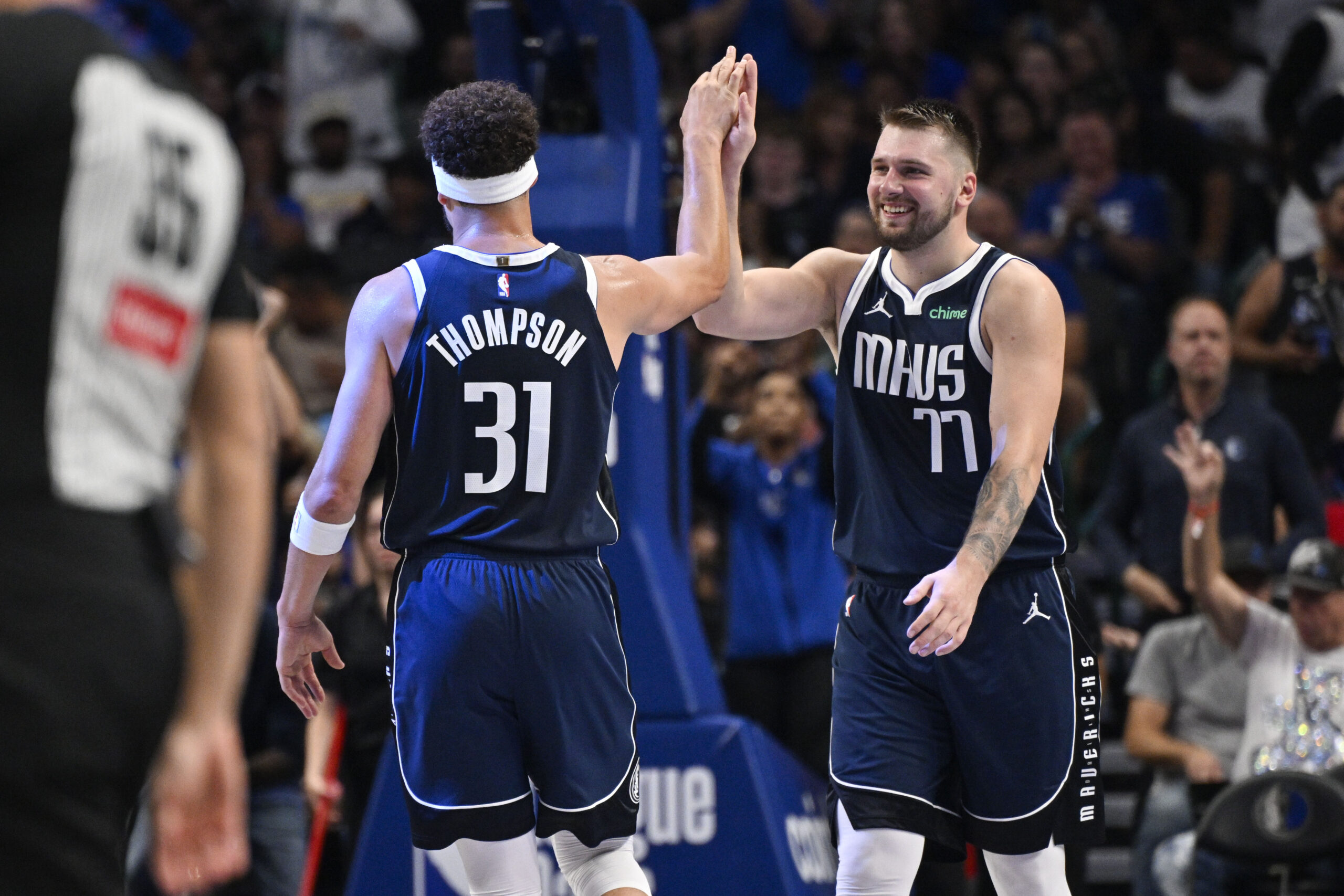 Oct 24, 2024; Dallas, Texas, USA; Dallas Mavericks guard Klay Thompson (31) and guard Luka Doncic (77) celebrate during the second half against the San Antonio Spurs at the American Airlines Center.