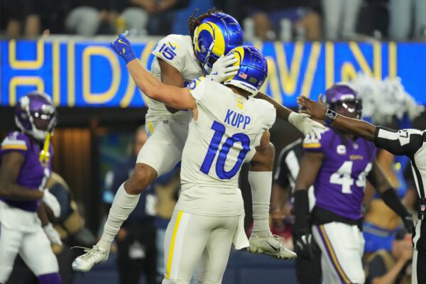 Oct 24, 2024; Inglewood, California, USA; Los Angeles Rams wide receiver Demarcus Robinson (15) celebrates with wide receiver Cooper Kupp (10) after scoring on a 25-yard touchdown reception against the Minnesota Vikings in the second half at SoFi Stadium. Mandatory Credit: Kirby Lee-Imagn Images