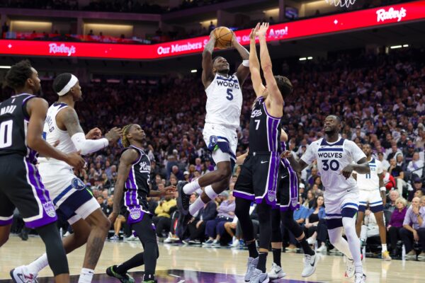 Oct 24, 2024; Sacramento, California, USA; Minnesota Timberwolves guard Anthony Edwards (5) drives to the basket against Sacramento Kings forward Doug McDermott (7) during the fourth quarter at Golden 1 Center. Mandatory Credit: Sergio Estrada-Imagn Images