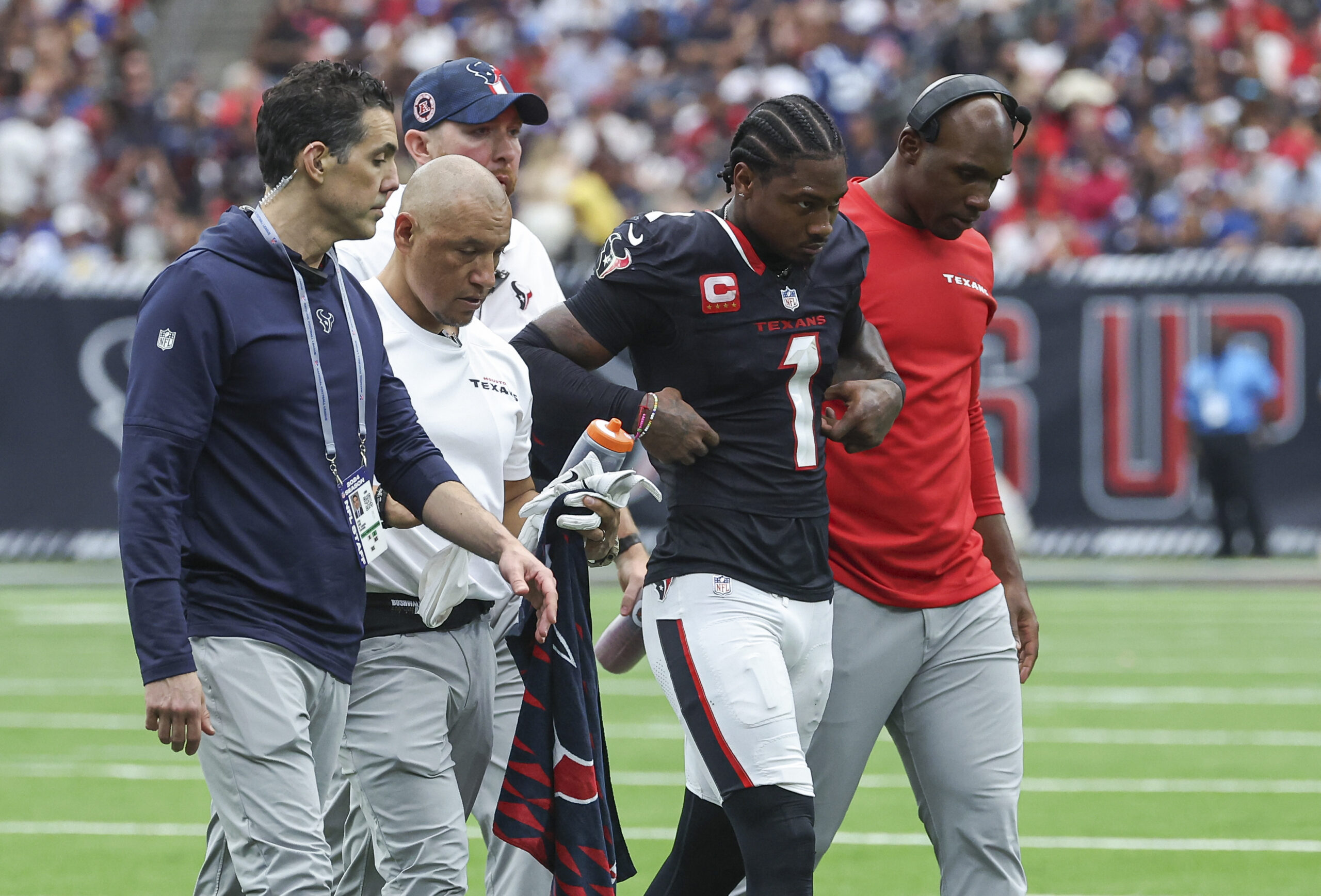 Oct 27, 2024; Houston, Texas, USA; Houston Texans wide receiver Stefon Diggs (1) walks off the field after an apparent injury during the third quarter against the Indianapolis Colts at NRG Stadium. Mandatory Credit: Troy Taormina-Imagn Images