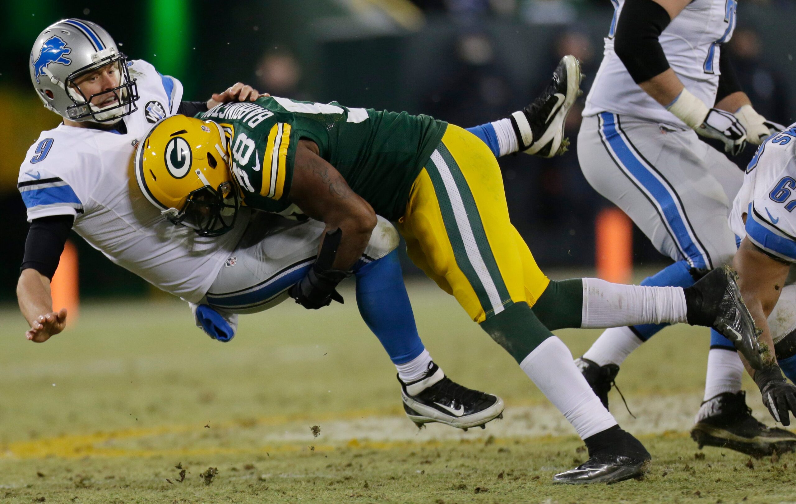 NFL; Detroit Lions quarterback Matthew Stafford is hammered by Green Bay Packers inside linebacker Sam Barrington during the third quarter of their game on Dec. 28, 2014, at Lambeau Field in Green Bay, Wis. The Green Bay Packers beat the Detroit Lions 30-20.