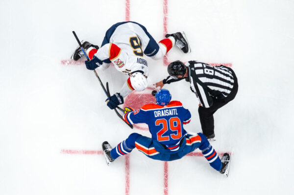 EDMONTON, CANADA - JUNE 21: Leon Draisaitl #29 of the Edmonton Oilers takes a face-off against Aleksander Barkov #16 of the Florida Panthers in Game Six of the 2024 Stanley Cup Final at Rogers Place on June 21, 2024, in Edmonton, Alberta, Canada.