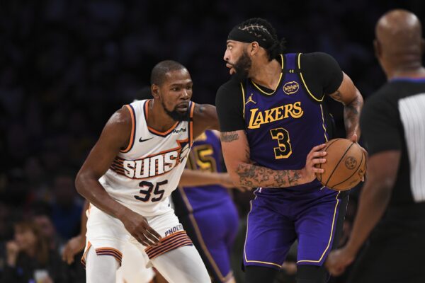 Oct 25, 2024; Los Angeles, California, USA; Los Angeles Lakers forward Anthony Davis (3) looks to pass against Phoenix Suns forward Kevin Durant (35) during the second half at Crypto.com Arena.