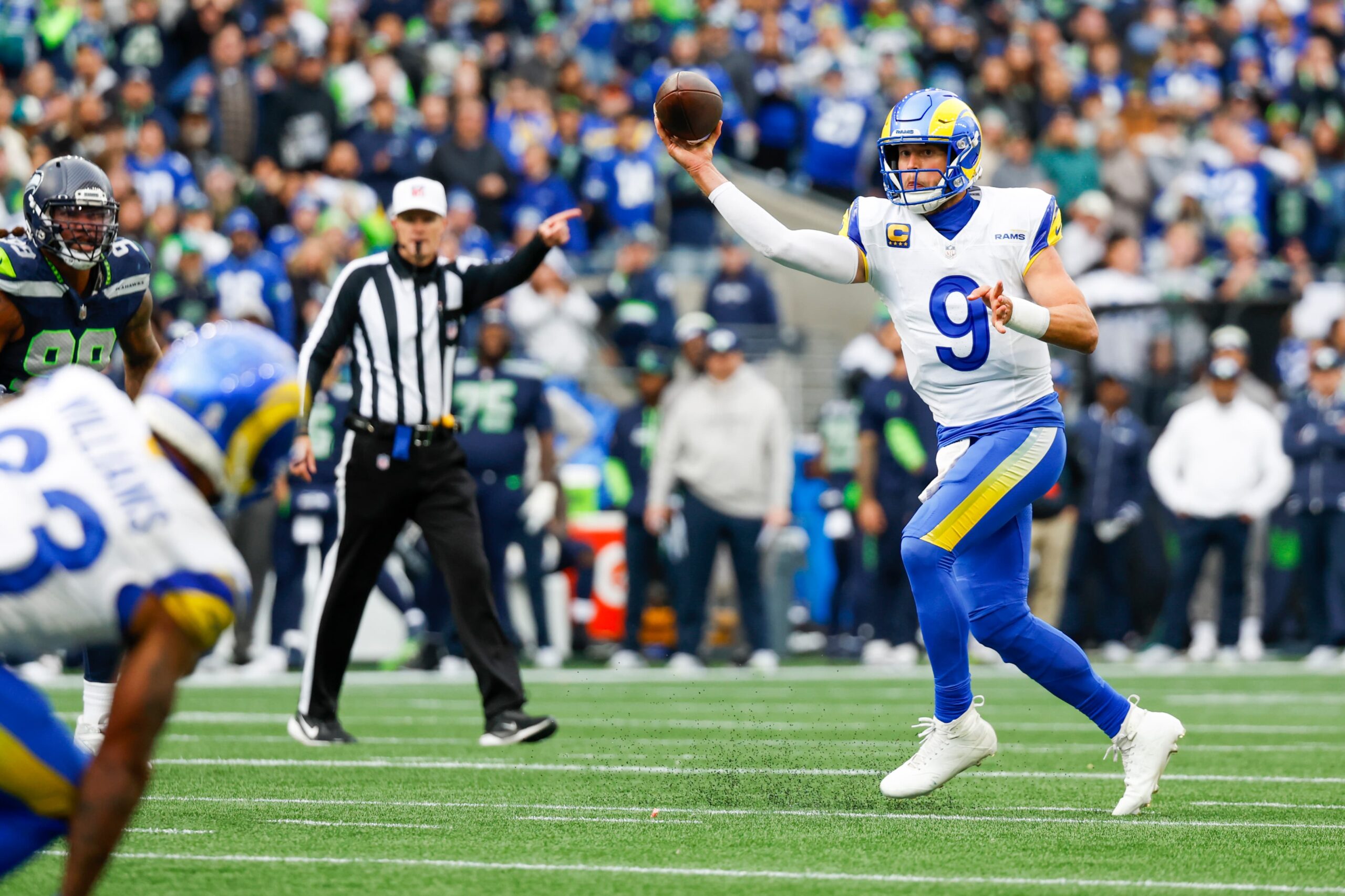 Nov 3, 2024; Seattle, Washington, USA; Los Angeles Rams quarterback Matthew Stafford (9) passes against the Seattle Seahawks during the second quarter at Lumen Field. Mandatory Credit: Joe Nicholson-Imagn Images