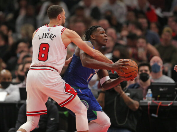 Feb 11, 2022; Chicago, Illinois, USA; NBA; Minnesota Timberwolves forward Anthony Edwards (1) is defended by Chicago Bulls guard Zach LaVine (8) during the first half at the United Center.