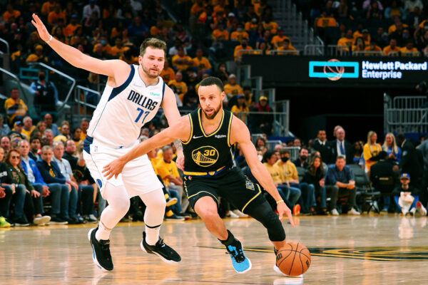 May 26, 2022; San Francisco, California, USA; Golden State Warriors guard Stephen Curry (30) dribbles the ball against Dallas Mavericks guard Luka Doncic (77) during the second half of game five of the 2022 western conference finals at Chase Center.