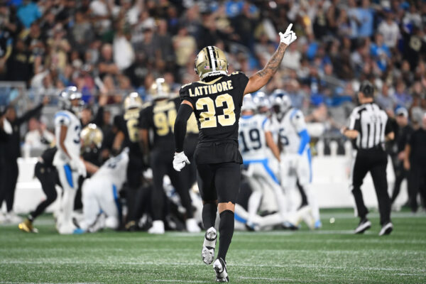 Sep 18, 2023; Charlotte, North Carolina, USA; New Orleans Saints cornerback Marshon Lattimore (23) signals a turnover by Carolina Panthers in the second quarter at Bank of America Stadium. Mandatory Credit: Bob Donnan-USA TODAY Sports