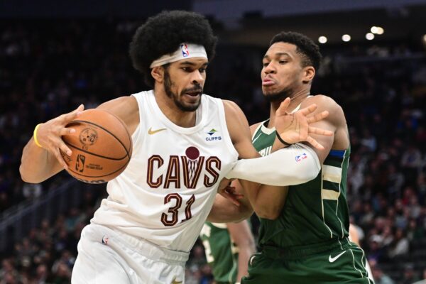 Jan 24, 2024; Milwaukee, Wisconsin, USA; Cleveland Cavaliers center Jarrett Allen (31) drives for the basket against Milwaukee Bucks forward Giannis Antetokounmpo (34) in the third quarter at Fiserv Forum.