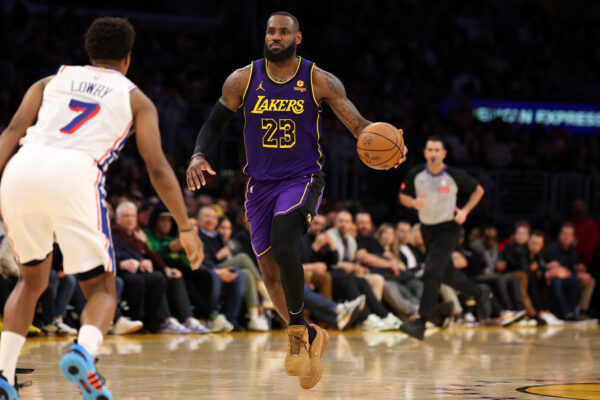 Mar 22, 2024; Los Angeles, California, USA; Los Angeles Lakers forward LeBron James (23) dribbles the ball against Philadelphia 76ers guard Kyle Lowry (7) during the fourth quarter at Crypto.com Arena.