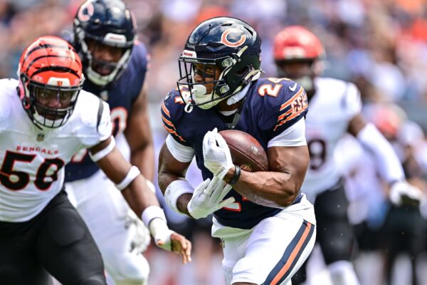 Aug 17, 2024; Chicago, Illinois, USA; Chicago Bears running back Khalil Herbert (24) runs the ball against the Cincinnati Bengals during the first quarter at Soldier Field.