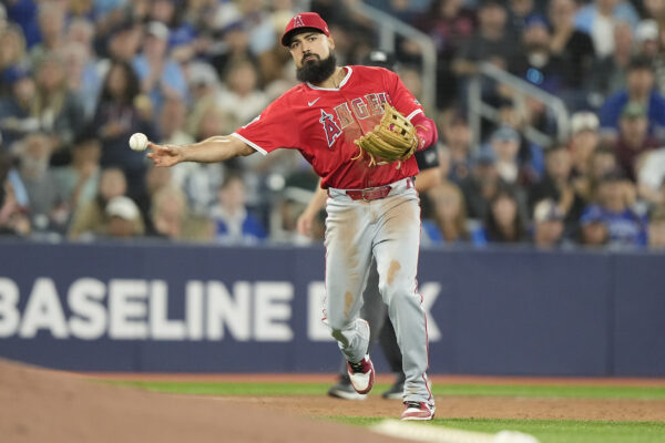 Aug 23, 2024; Toronto, Ontario, CAN; Los Angeles Angels third baseman Anthony Rendon (6) throws out Toronto Blue Jays shortstop Ernie Clement (not pictured) at first base during the sixth inning at Rogers Centre. Mandatory Credit: John E. Sokolowski-USA TODAY Sports