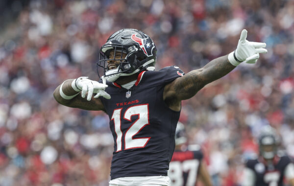 Sep 29, 2024; Houston, Texas, USA; Houston Texans wide receiver Nico Collins (12) signals after a first down during the first quarter against the Jacksonville Jaguars at NRG Stadium. Mandatory Credit: Troy Taormina-Imagn Images