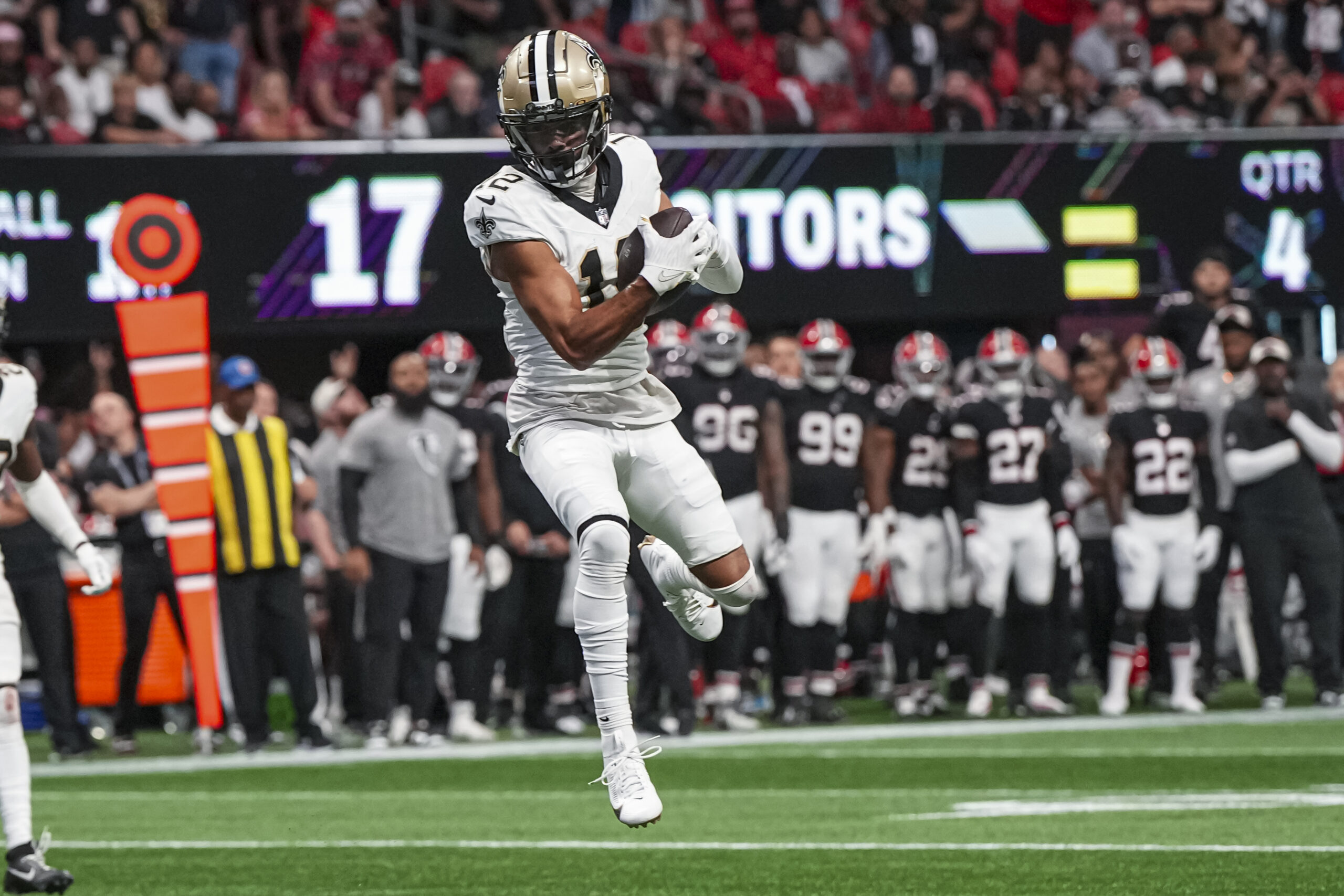 Sep 29, 2024; Atlanta, Georgia, USA; New Orleans Saints wide receiver Chris Olave (12) catches a pass against the Atlanta Falcons during the fourth quarter at Mercedes-Benz Stadium. Mandatory Credit: Dale Zanine-Imagn Images