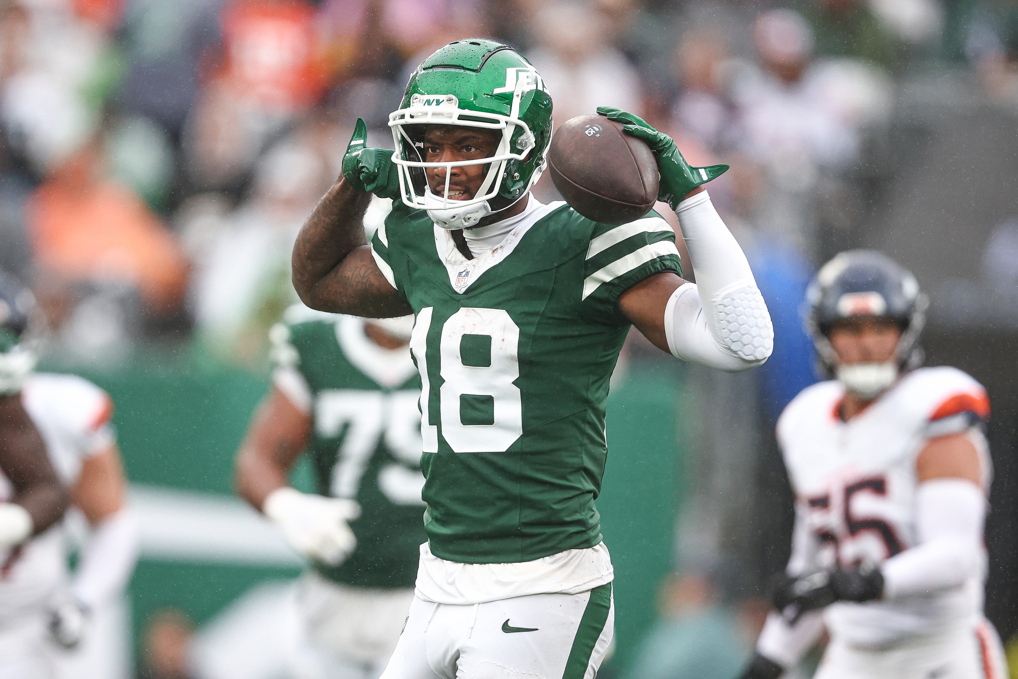 Sep 29, 2024; East Rutherford, New Jersey, USA; New York Jets wide receiver Mike Williams (18) celebrates a first down reception during the second half against the Denver Broncos at MetLife Stadium.