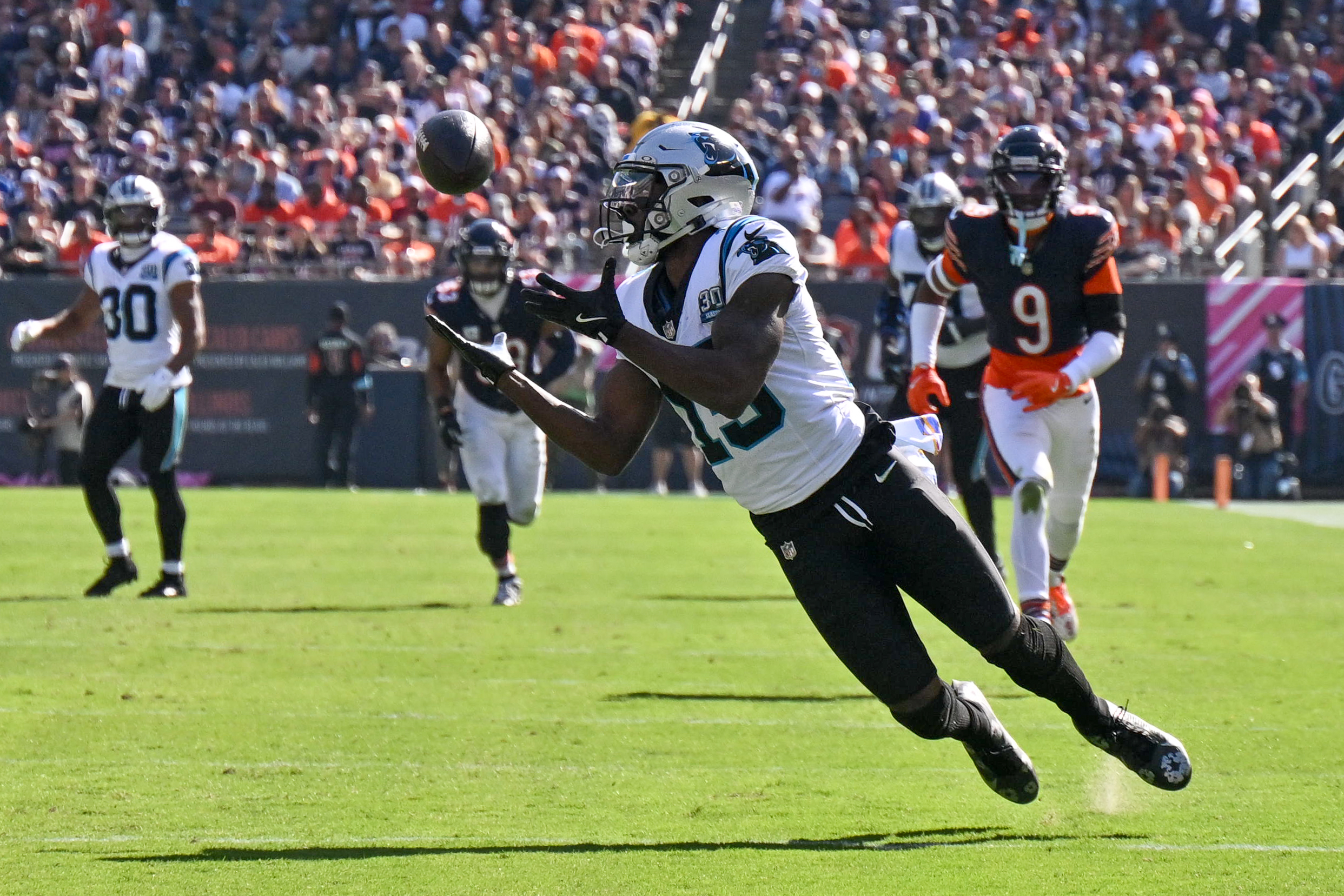 Oct 6, 2024; Chicago, Illinois, USA; Carolina Panthers wide receiver Jonathan Mingo (15) makes a diving catch against the Chicago Bears during the third quarter at Soldier Field. Mandatory Credit: Daniel Bartel-Imagn Images