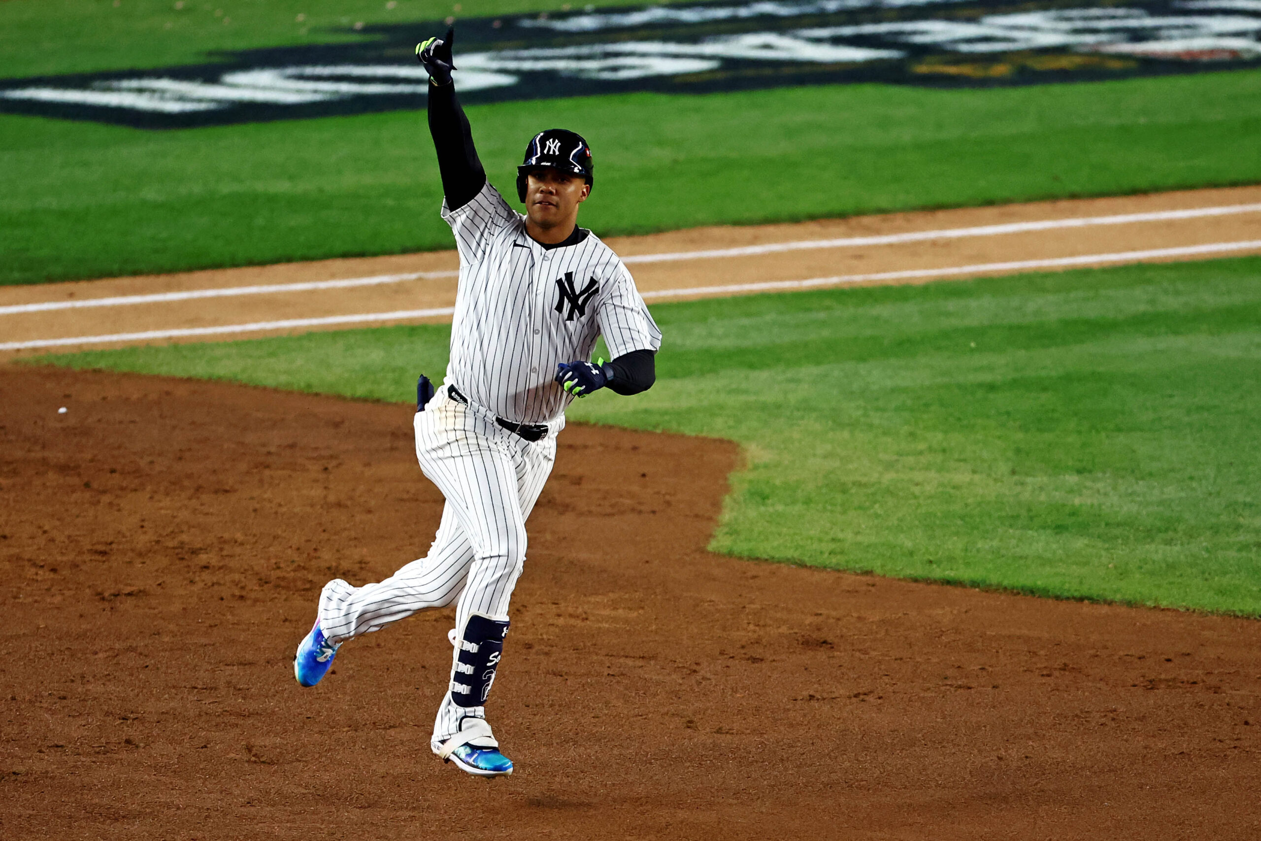 Oct 14, 2024; Bronx, New York, USA; New York Yankees outfielder Juan Soto (22) runs the bases after hitting a solo home run during the third inning against the Cleveland Guardians in game one of the ALCS for the 2024 MLB Playoffs at Yankee Stadium. Mandatory Credit: Vincent Carchietta-Imagn Images