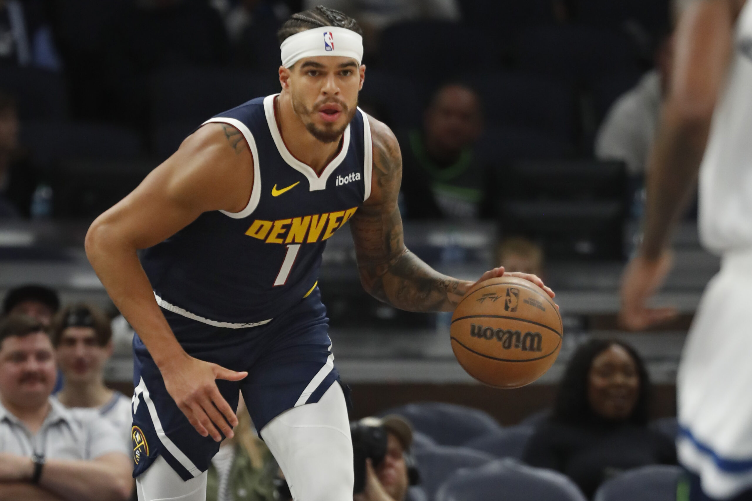 Oct 17, 2024; Minneapolis, Minnesota, USA; Denver Nuggets forward Michael Porter Jr. (1) brings the ball up court against the Minnesota Timberwolves in the first quarter at Target Center.