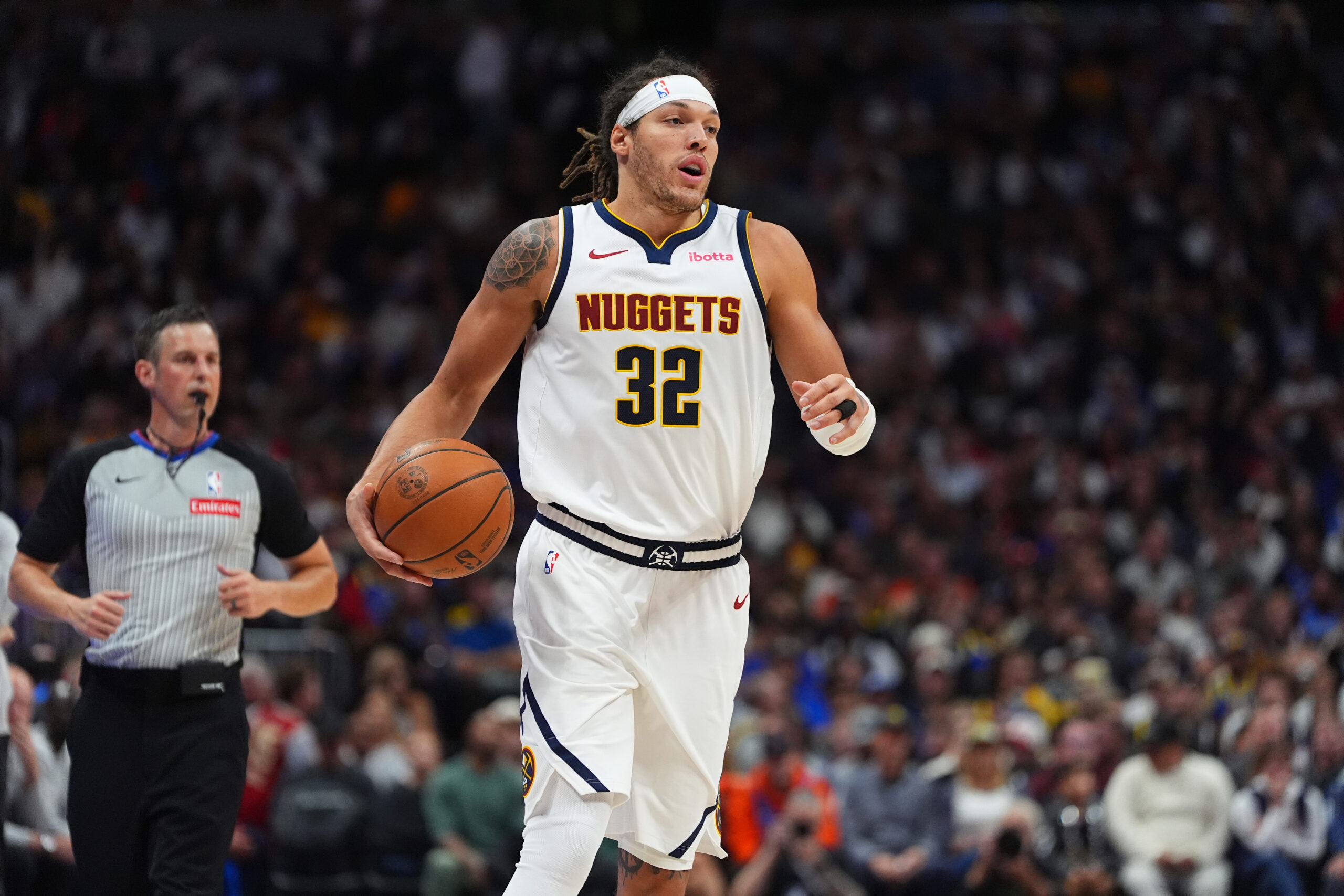 Oct 24, 2024; Denver, Colorado, USA; Denver Nuggets forward Aaron Gordon (32) controls the ball in the second half against the Oklahoma City Thunder at Ball Arena.