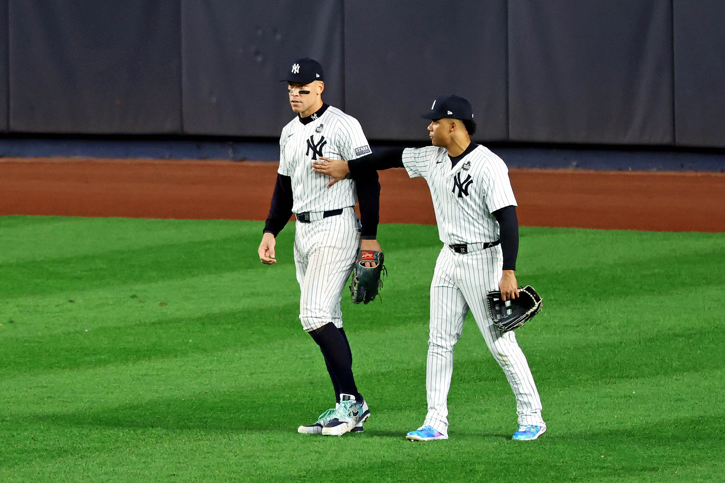 Oct 30, 2024; Bronx, New York, USA, MLB; New York Yankees outfielder Juan Soto (22) reacts with outfielder Aaron Judge (99) after Judge dropped a fly ball during the fifth inning against the Los Angeles Dodgers during game five of the 2024 MLB World Series at Yankee Stadium. Mandatory Credit: James Lang-Imagn Images