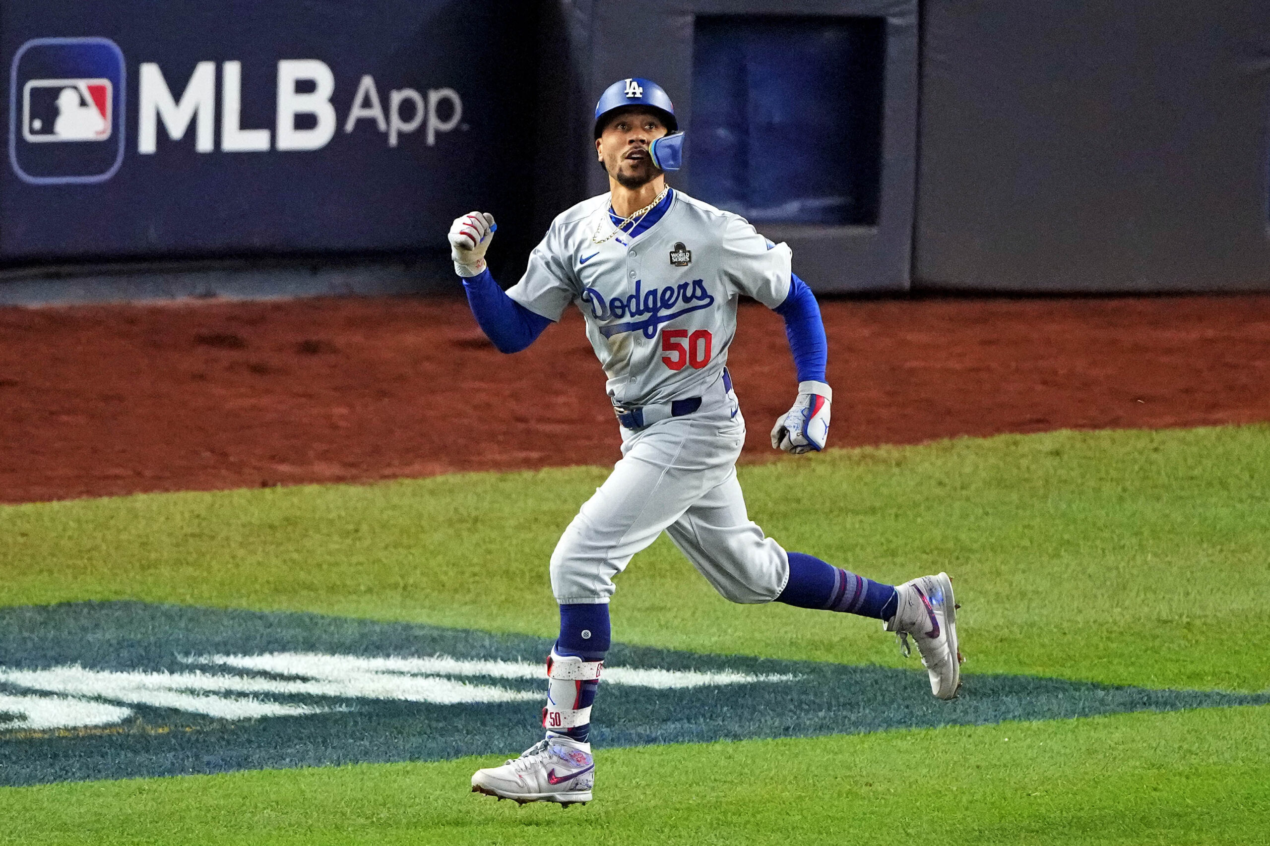 Oct 30, 2024; New York, New York, USA; Los Angeles Dodgers shortstop Mookie Betts (50) celebrates after hitting a sacrifice fly during the eighth inning against the New York Yankees in game four of the 2024 MLB World Series at Yankee Stadium. Mandatory Credit: Brad Penner-Imagn Images