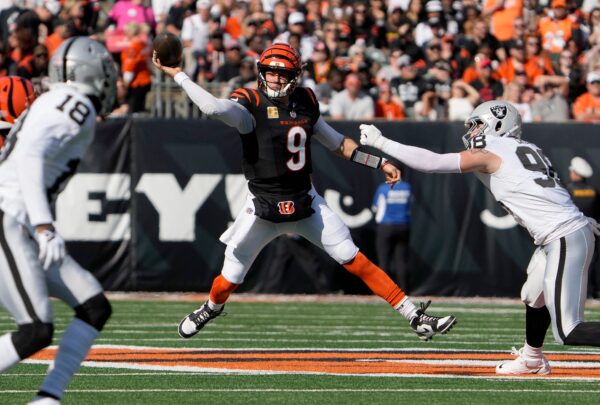 Cincinnati Bengals quarterback Joe Burrow (9) makes in the 1st quarter over Las Vegas Raiders at Paycor Stadium Sunday, November 3, 2024.