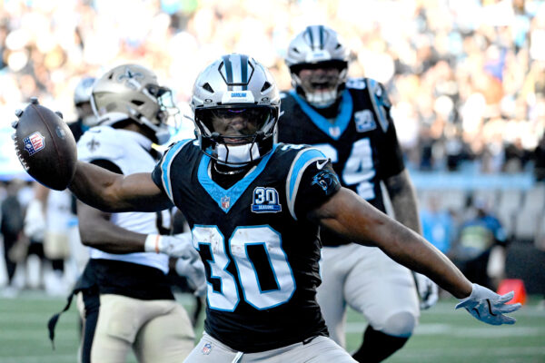 Nov 3, 2024; Charlotte, North Carolina, USA; Carolina Panthers running back Chuba Hubbard (30) celebrates after scoring the winning touchdown in the fourth qarter at Bank of America Stadium.