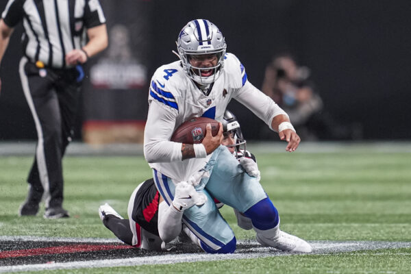 Nov 3, 2024; Atlanta, Georgia, USA; Dallas Cowboys quarterback Dak Prescott (4) is tackled from behind by Atlanta Falcons linebacker Kaden Elliss (55) during the second half at Mercedes-Benz Stadium. Mandatory Credit: Dale Zanine-Imagn Images