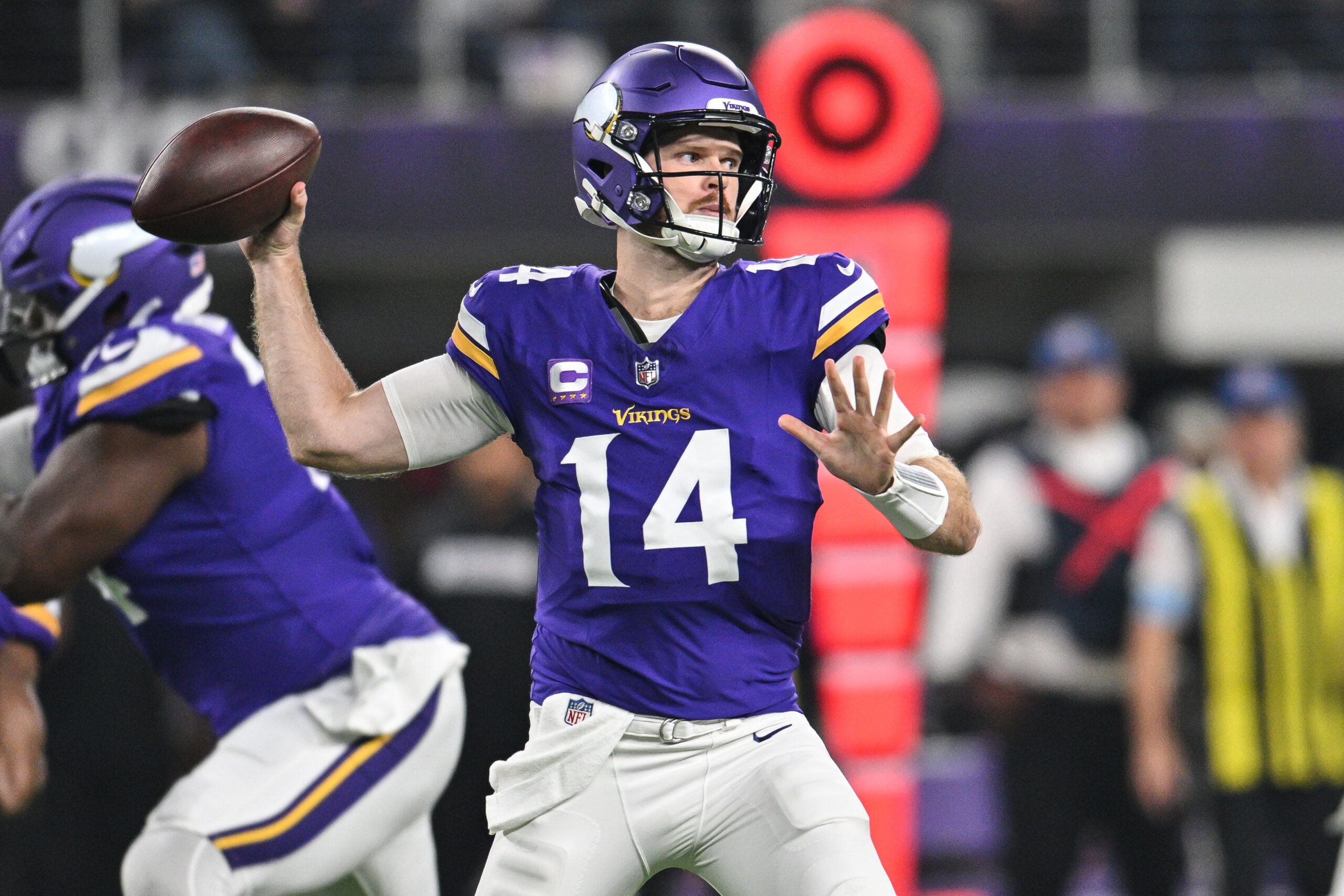 Nov 3, 2024; Minneapolis, Minnesota, USA; Minnesota Vikings quarterback Sam Darnold (14) throws a pass against the Indianapolis Colts during the first quarter at U.S. Bank Stadium. Mandatory Credit: Jeffrey Becker-Imagn Images