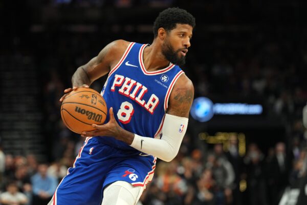 Nov 4, 2024; Phoenix, Arizona, USA; Philadelphia 76ers forward Paul George (8) protects the ball against the Phoenix Suns during the first half at Footprint Center. Mandatory Credit: Joe Camporeale-Imagn Images