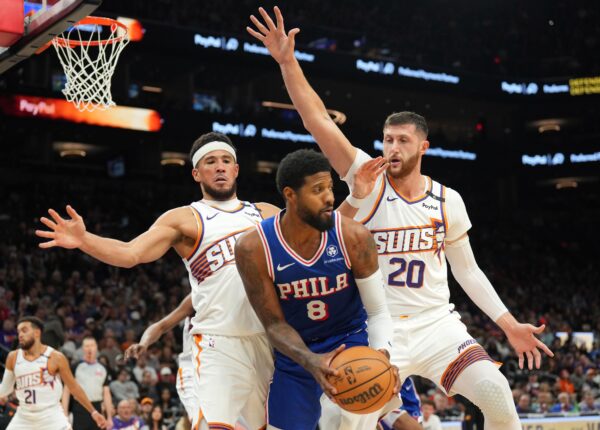 Nov 4, 2024; Phoenix, Arizona, USA; Phoenix Suns guard Devin Booker (1) and Phoenix Suns center Jusuf Nurkic (20) guard Philadelphia 76ers forward Paul George (8) during the second half at Footprint Center. Mandatory Credit: Joe Camporeale-Imagn Images