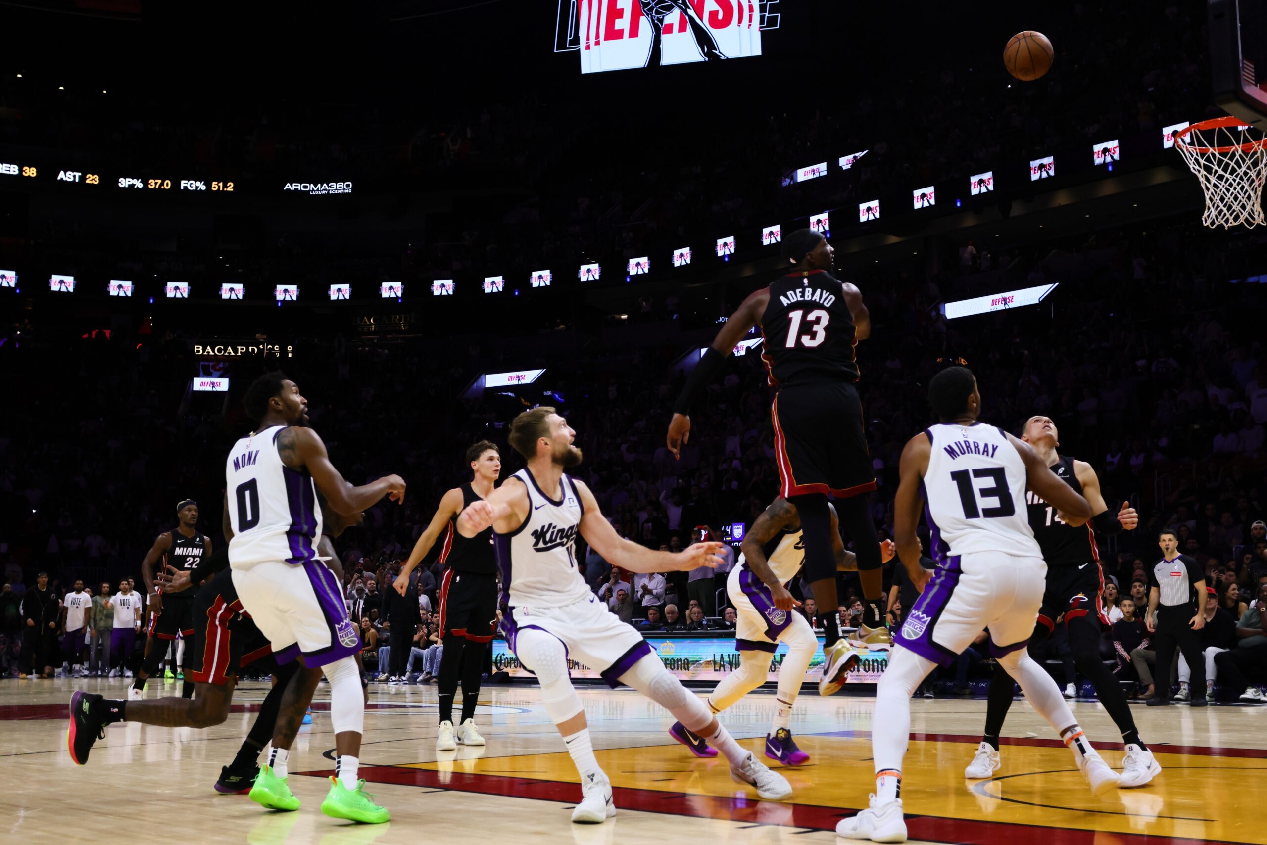 Nov 4, 2024; Miami, Florida, USA; Sacramento Kings forward Domantas Sabonis (11) shoots the game-winning basket over Miami Heat center Bam Adebayo (13) during the fourth quarter at Kaseya Center. Mandatory Credit: Sam Navarro-Imagn Images