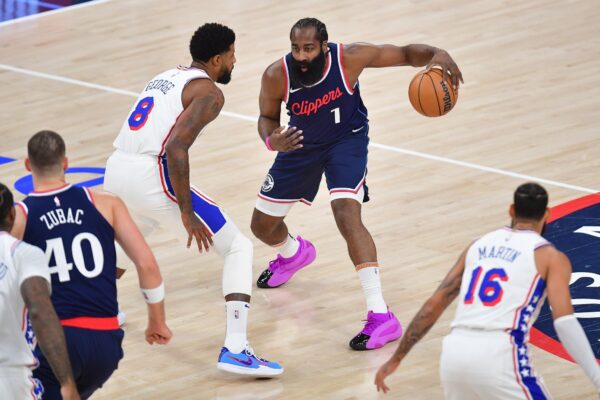 Nov 6, 2024; Inglewood, California, USA; Los Angeles Clippers guard James Harden (1) controls the ball against Philadelphia 76ers forward Paul George (8) during the first half at Intuit Dome. Mandatory Credit: Gary A. Vasquez-Imagn Images