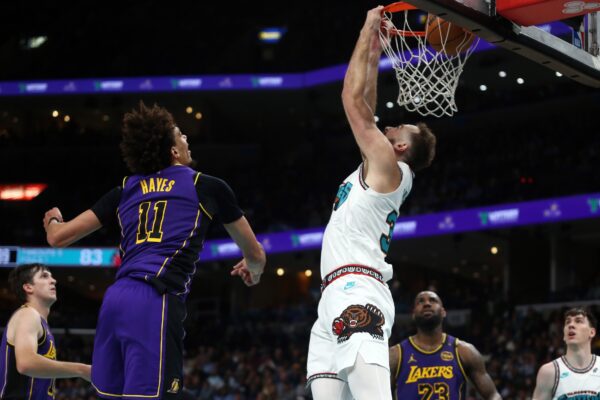 Nov 6, 2024; Memphis, Tennessee, USA; Memphis Grizzlies center Jay Huff (30) dunks during the second half against the Los Angeles Lakers at FedExForum. Mandatory Credit: Petre Thomas-Imagn Images