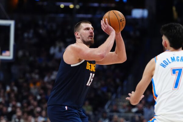 Nov 6, 2024; Denver, Colorado, USA; Denver Nuggets center Nikola Jokic (15) prepares to shoot the ball in the second half against the Oklahoma City Thunder at Ball Arena.