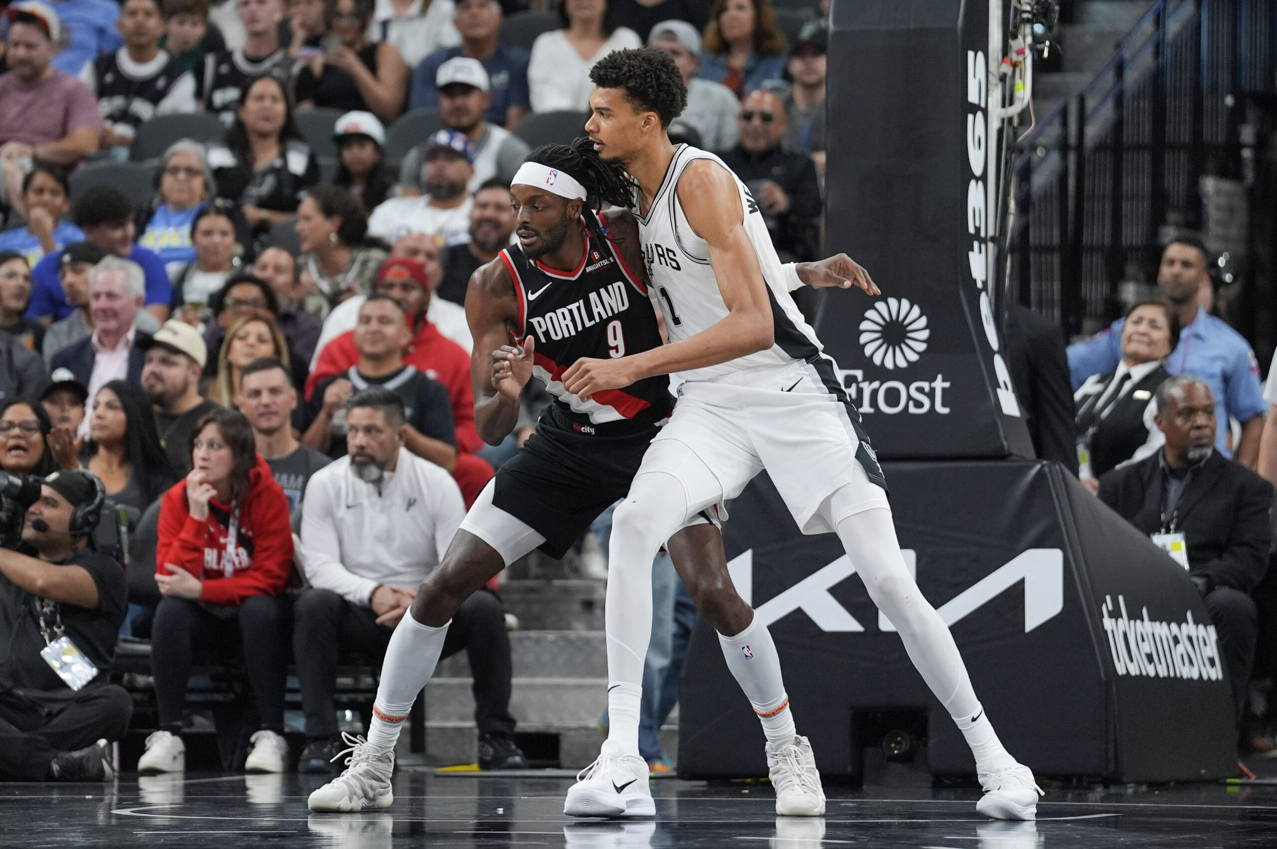 Nov 7, 2024; San Antonio, Texas, USA; Portland Trail Blazers forward Jerami Grant (9) and San Antonio Spurs center Victor Wembanyama (1) battle for position in the second half at Frost Bank Center. Mandatory Credit: Daniel Dunn-Imagn Images