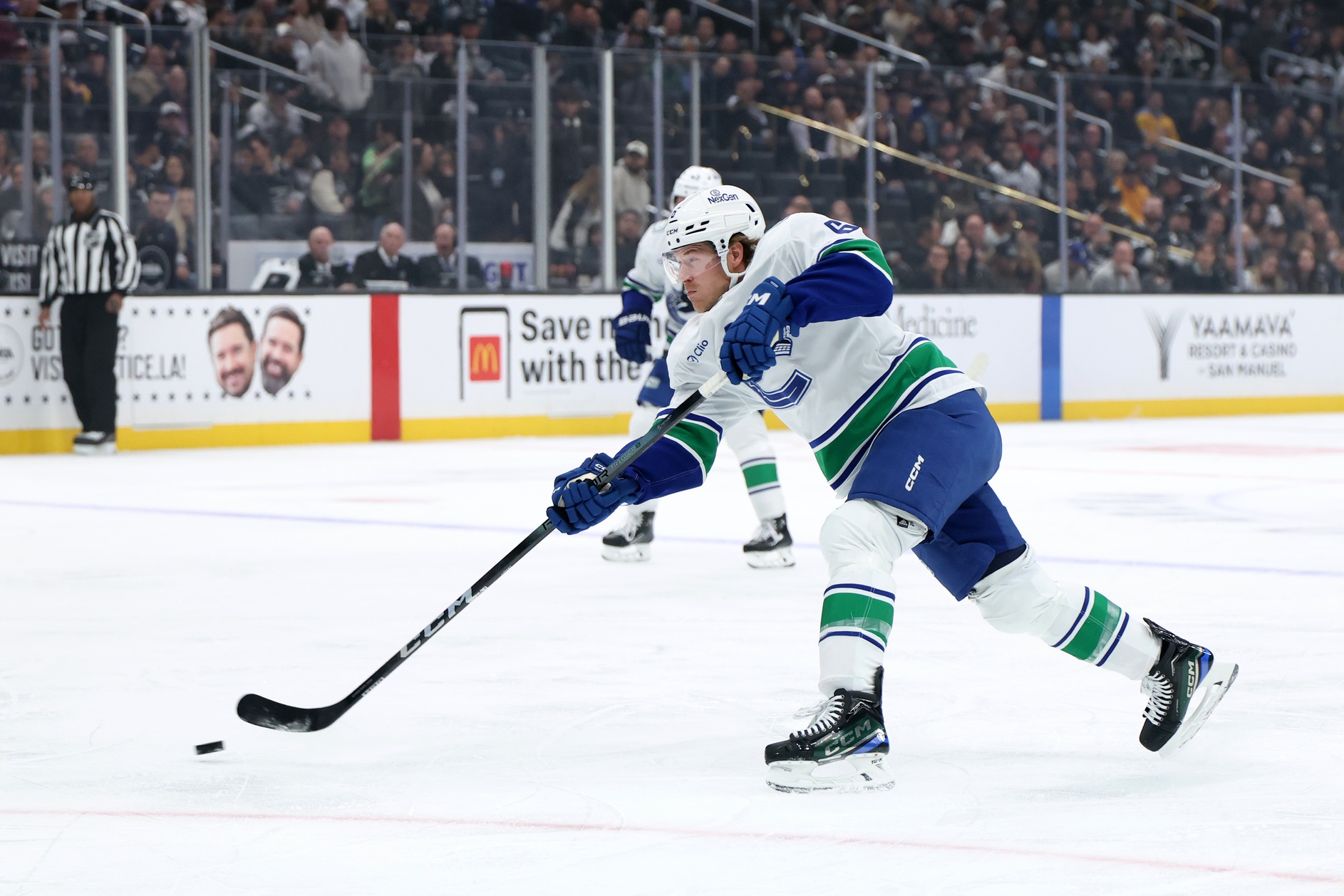 Nov 7, 2024; Los Angeles, California, USA; Vancouver Canucks right wing Brock Boeser (6) shoots the puck during the first period against the Los Angeles Kings at Crypto.com Arena. Mandatory Credit: Kiyoshi Mio-Imagn Images