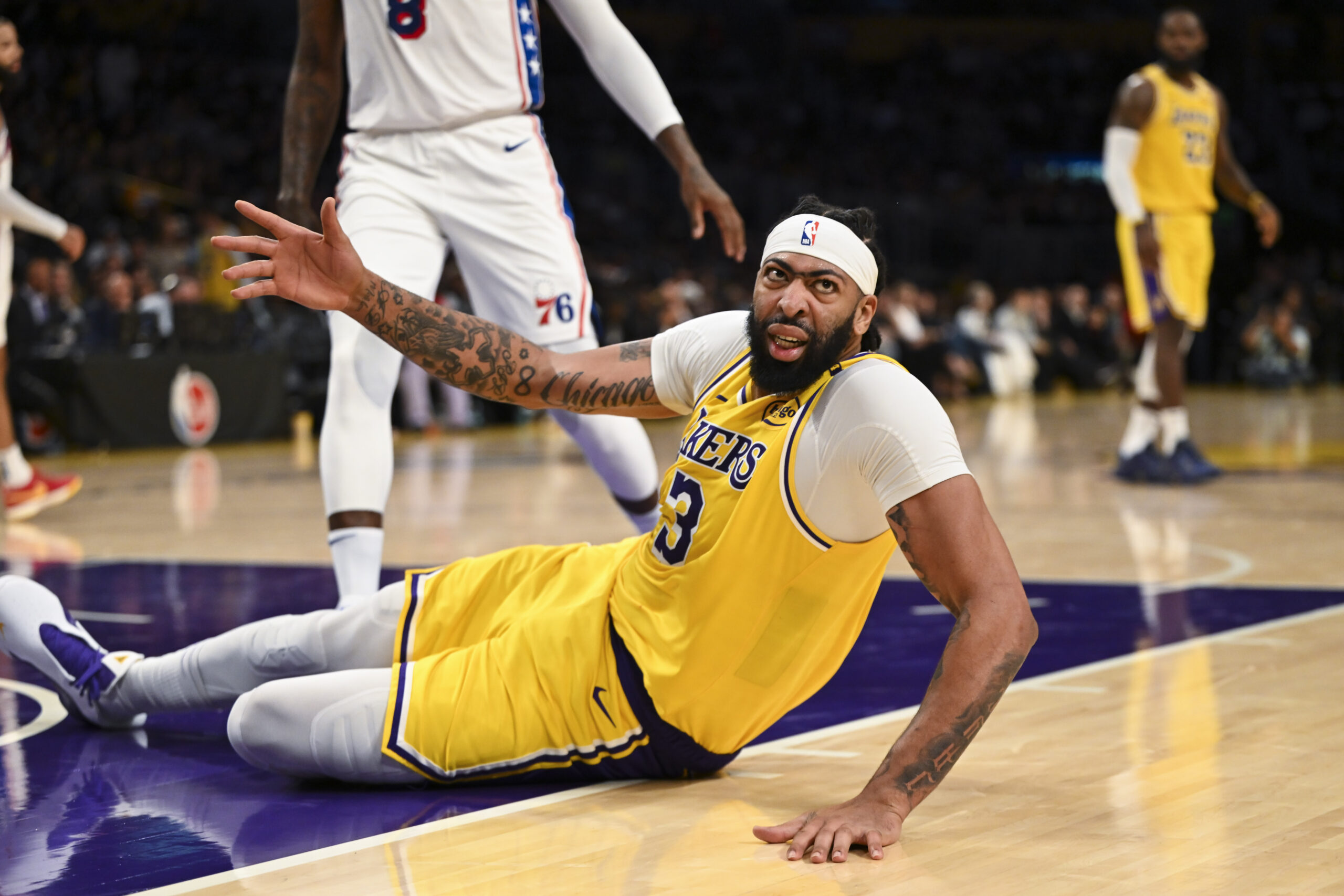 Nov 8, 2024; Los Angeles, California, USA; Los Angeles Lakers forward Anthony Davis (3) reacts after being fouled against the Philadelphia 76ers during the second half at Crypto.com Arena.