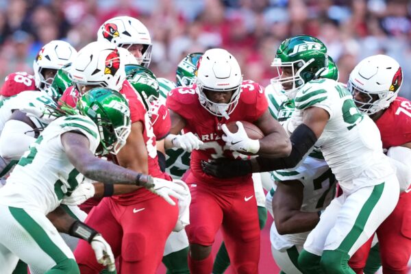 Nov 10, 2024; Glendale, Arizona, USA; Arizona Cardinals running back Trey Benson (33) runs against the New York Jets during the first half at State Farm Stadium. Mandatory Credit: Joe Camporeale-Imagn Images