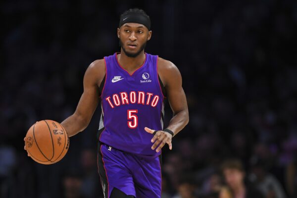 Nov 10, 2024; Los Angeles, California, USA; Toronto Raptors guard Immanuel Quickley (5) dribbles the ball against the Los Angeles Lakers during the second half at Crypto.com Arena.