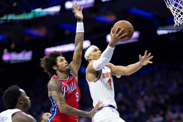 Nov 12, 2024; Philadelphia, Pennsylvania, USA; New York Knicks guard Josh Hart (3) drives for a shot in front of Philadelphia 76ers guard Kelly Oubre Jr. (9) during the second quarter at Wells Fargo Center.