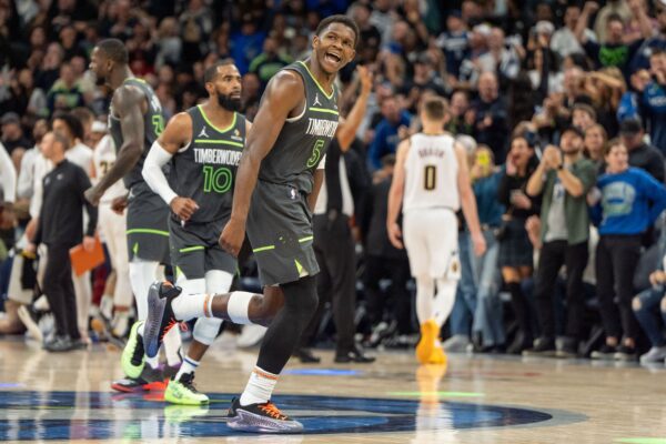 Nov 1, 2024; Minneapolis, Minnesota, USA; Minnesota Timberwolves guard Anthony Edwards (5) celebrates after scoring to put the Minnesota Timberwolves up with 16 seconds left in the game against the Denver Nuggets in the fourth quarter at Target Center.